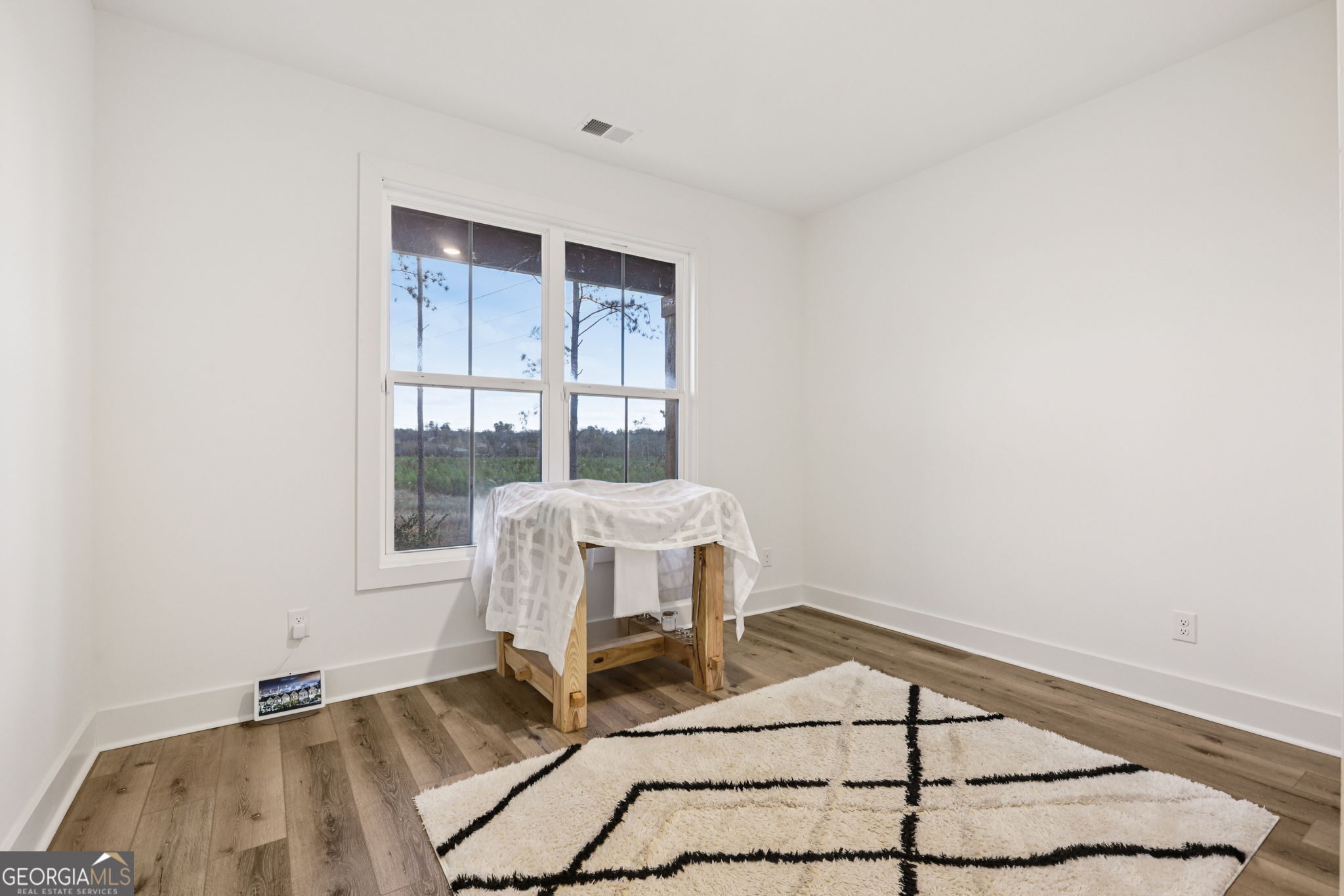 779 Millen Road Monticello, GA 31064 - Photo 20 of 52 a bedroom with a bed and a window