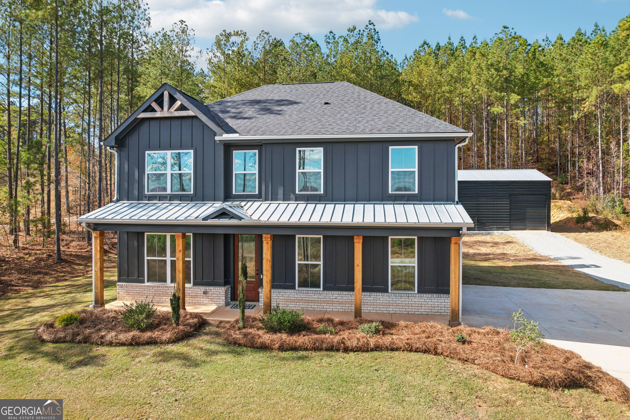 779 Millen Road Monticello, GA 31064 - Photo 2 of 52 a front view of a house with garden