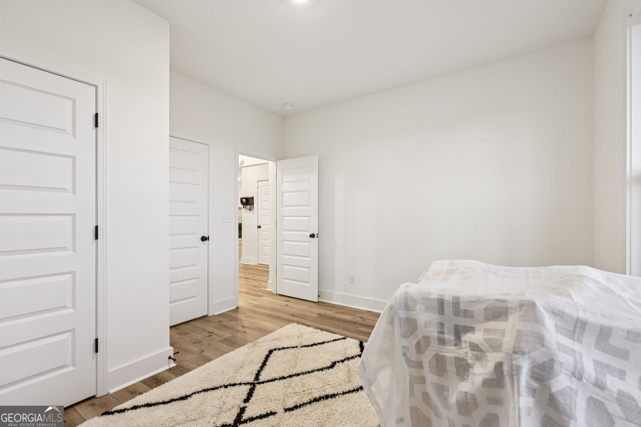 779 Millen Road Monticello, GA 31064 - Photo 21 of 52 a bedroom with a bed and walk in closet