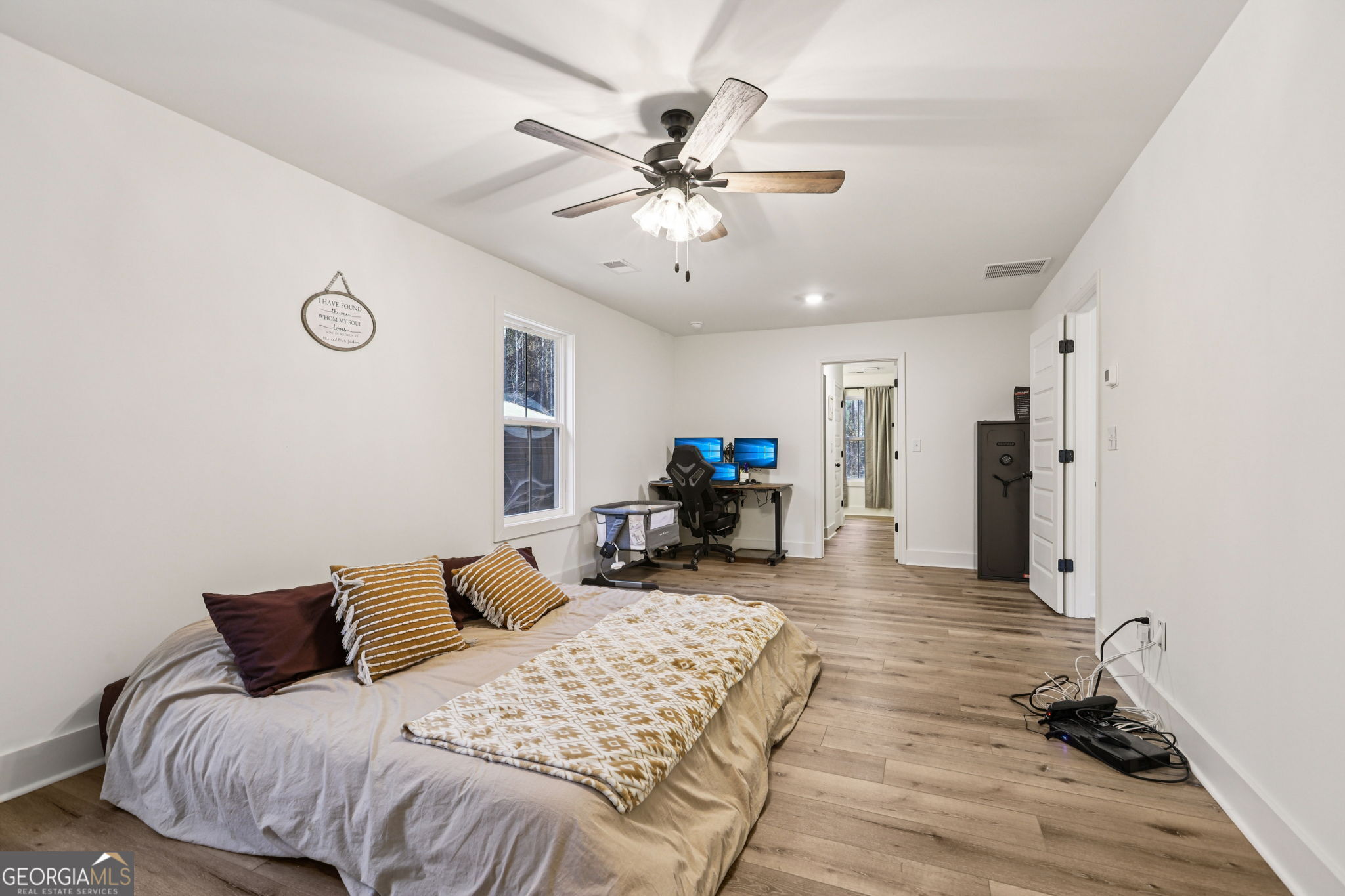 779 Millen Road Monticello, GA 31064 - Photo 23 of 52 a bed room with a bed mirror and a tv