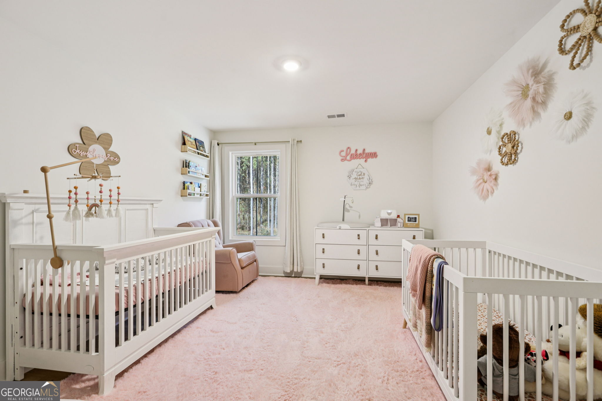 779 Millen Road Monticello, GA 31064 - Photo 28 of 52 a bedroom with furniture and baby crib