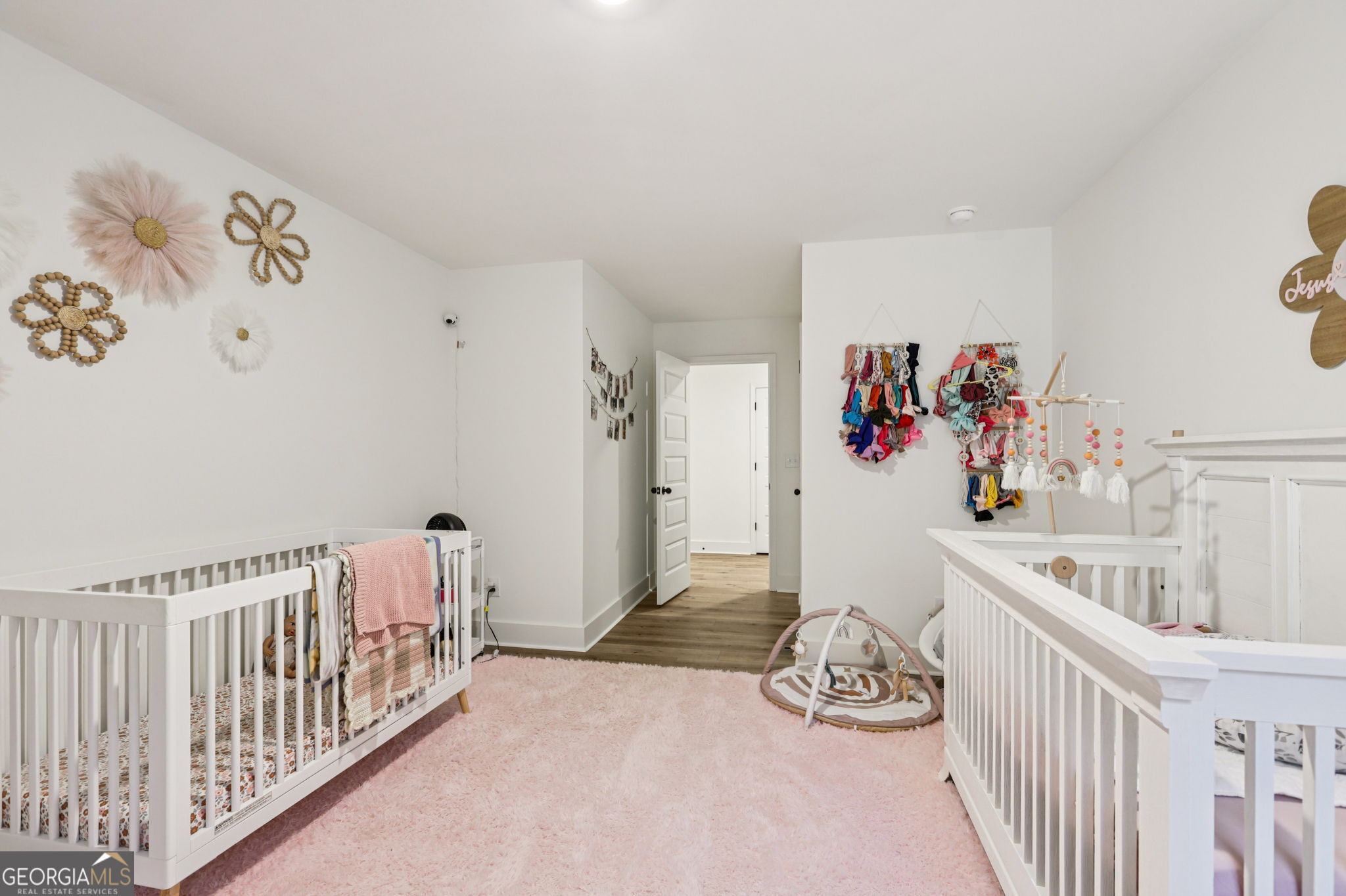 779 Millen Road Monticello, GA 31064 - Photo 29 of 52 a bedroom with furniture and baby crib