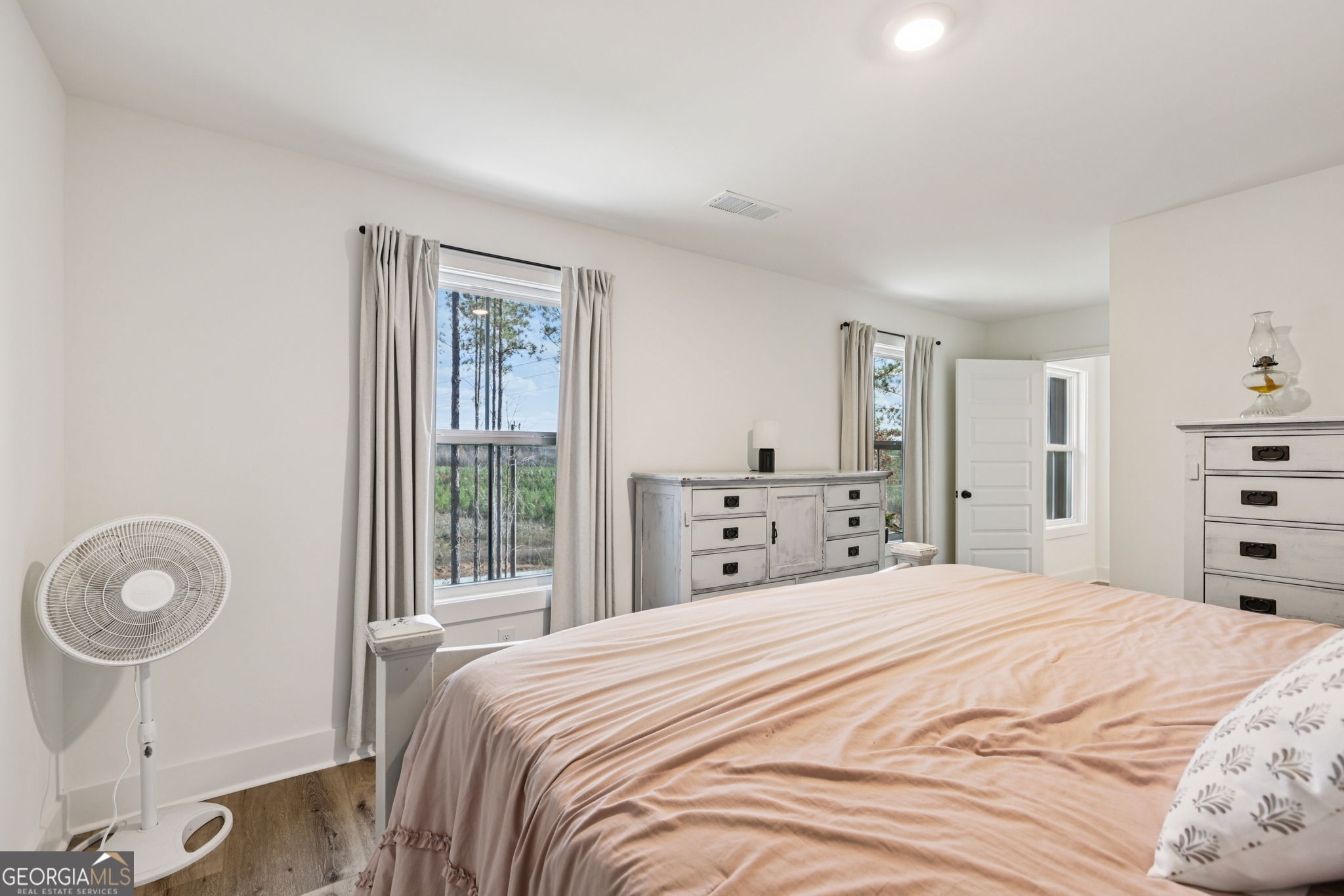 779 Millen Road Monticello, GA 31064 - Photo 32 of 52 a bedroom with a bed and a closet