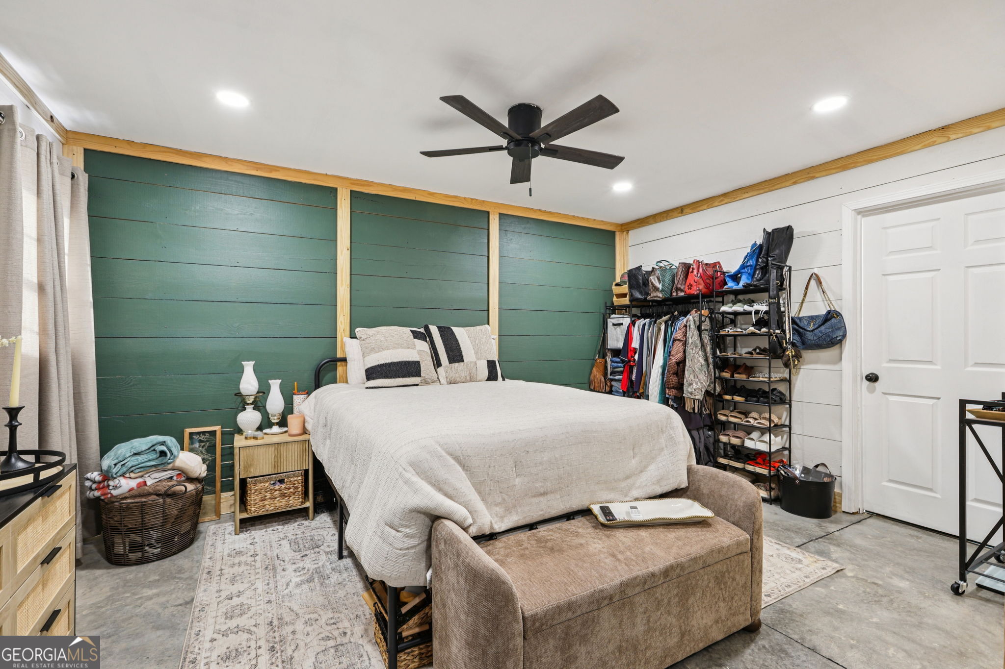 779 Millen Road Monticello, GA 31064 - Photo 39 of 52 a bedroom with a bed and a walk in closet