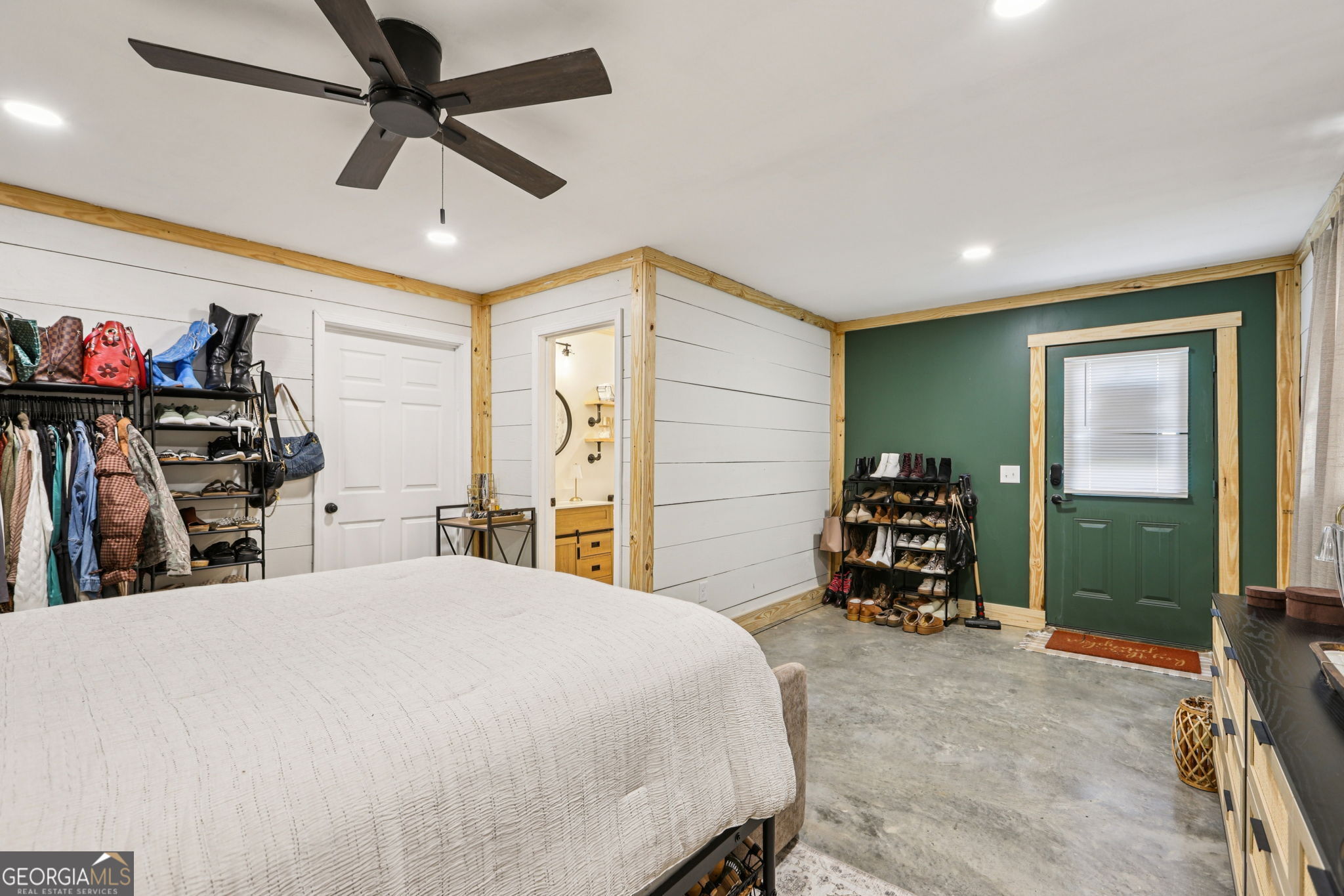 779 Millen Road Monticello, GA 31064 - Photo 40 of 52 a bedroom with a bed and a large mirror