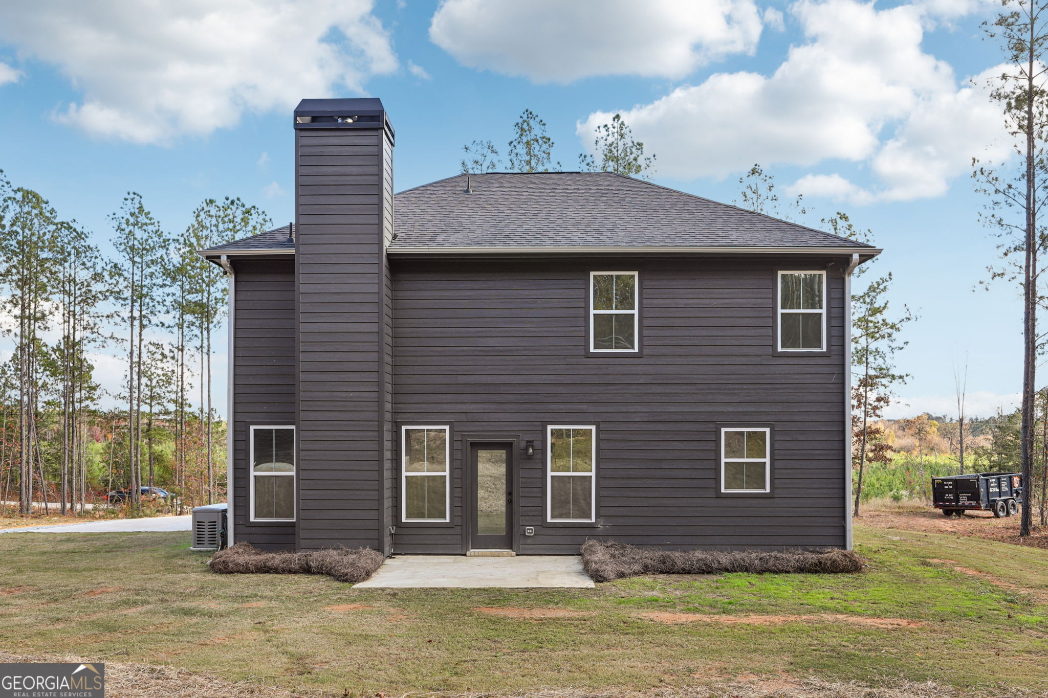 779 Millen Road Monticello, GA 31064 - Photo 5 of 52 a front view of a house with a yard