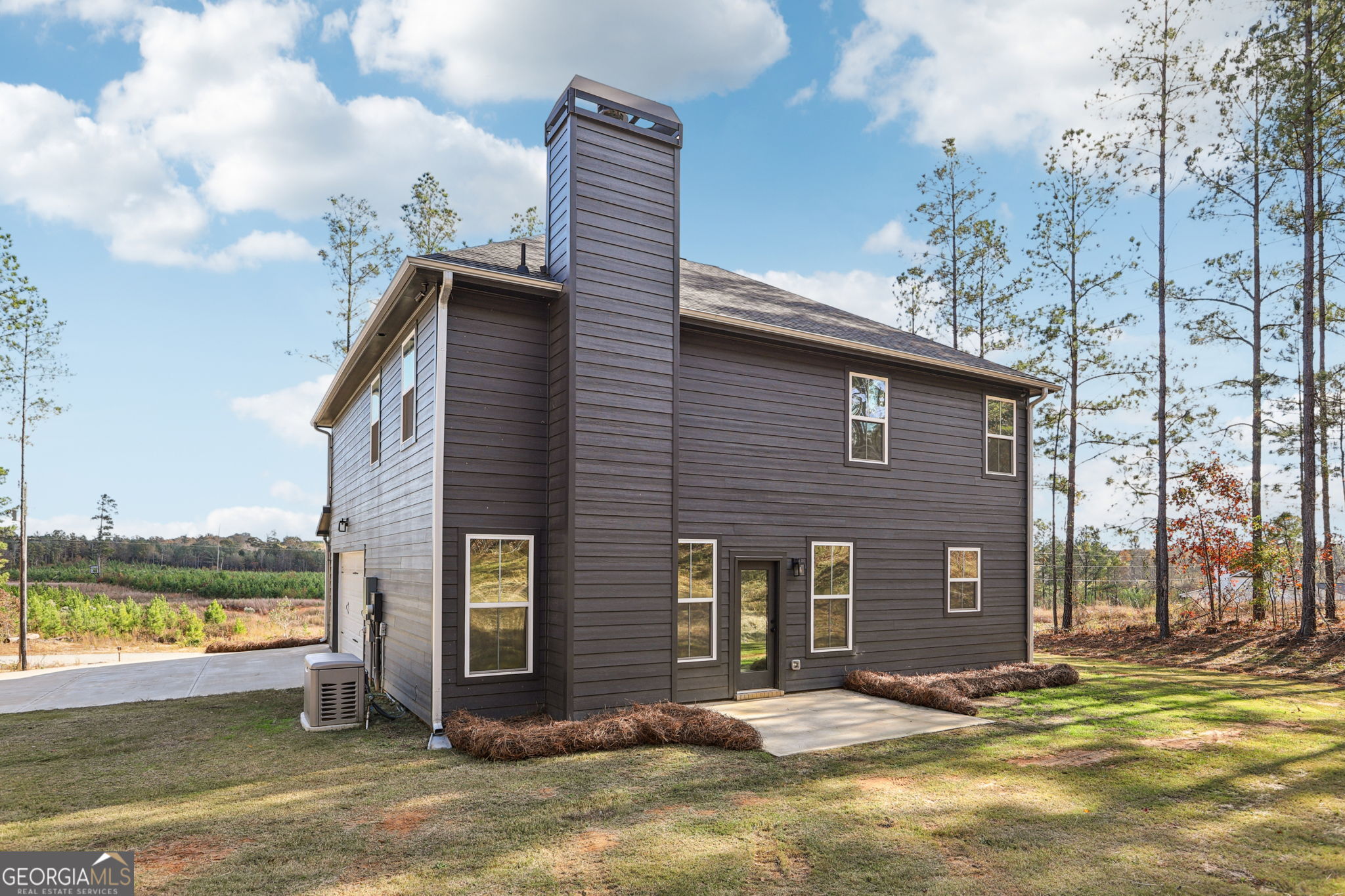 779 Millen Road Monticello, GA 31064 - Photo 6 of 52 a front view of a house with a yard
