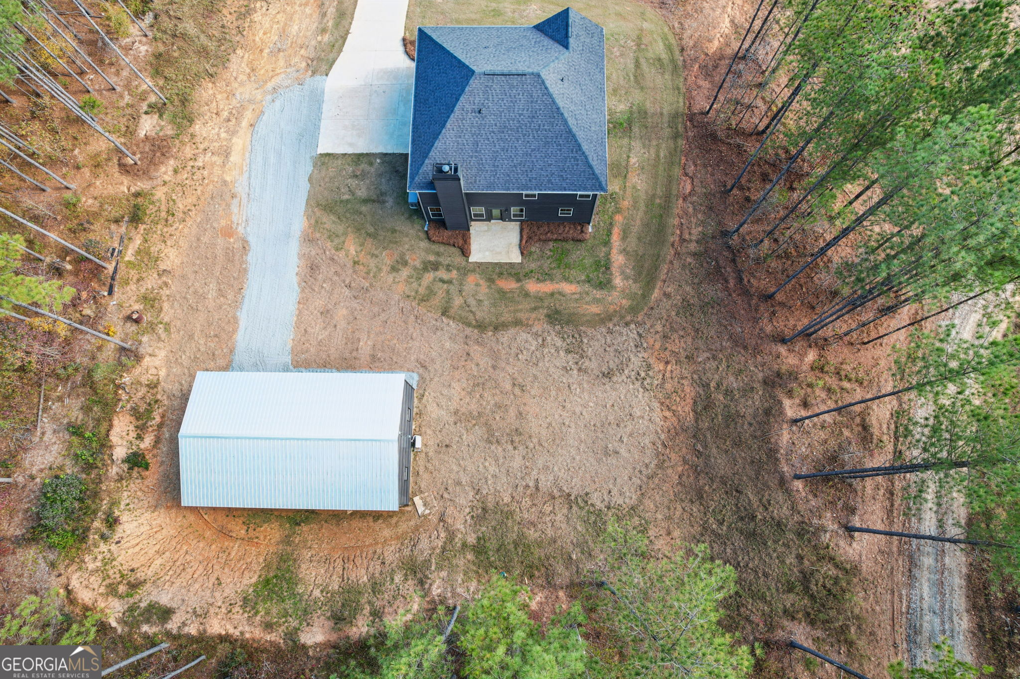 779 Millen Road Monticello, GA 31064 - Photo 9 of 52 a picture of a tree in front of a house