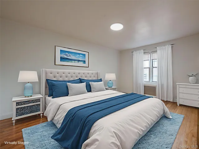 a bedroom with bed and a window