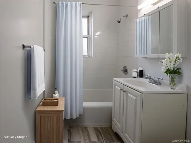 a bathroom with a sink a toilet and tub