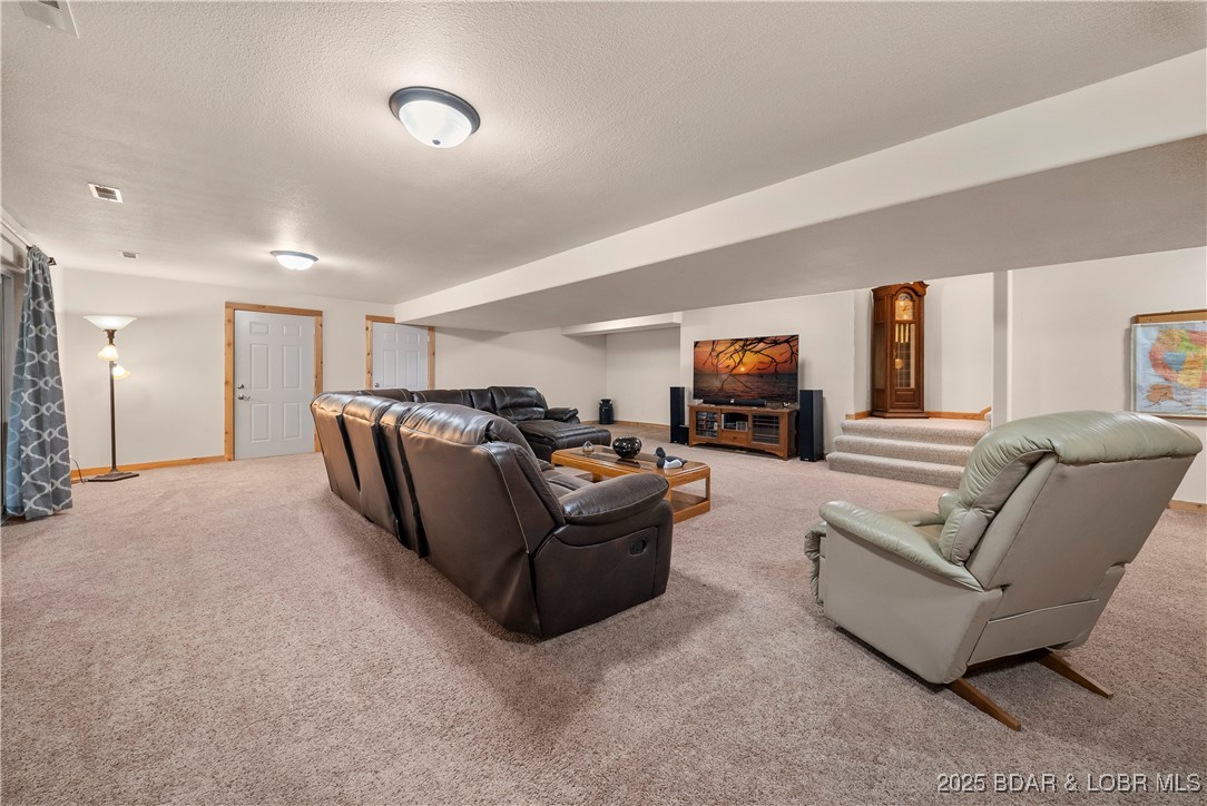 14613 Old Marvin Road Versailles, MO 65084 - Photo 37 of 73 Main House Lower Level Entertaining Space