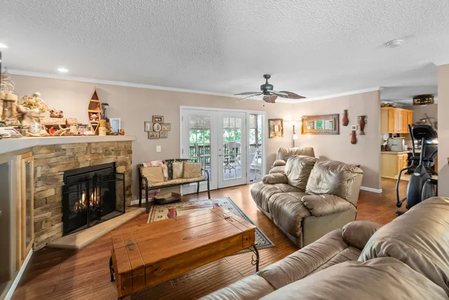 a living room with furniture fireplace and a flat screen tv