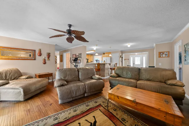 a living room with furniture fireplace and flat screen tv