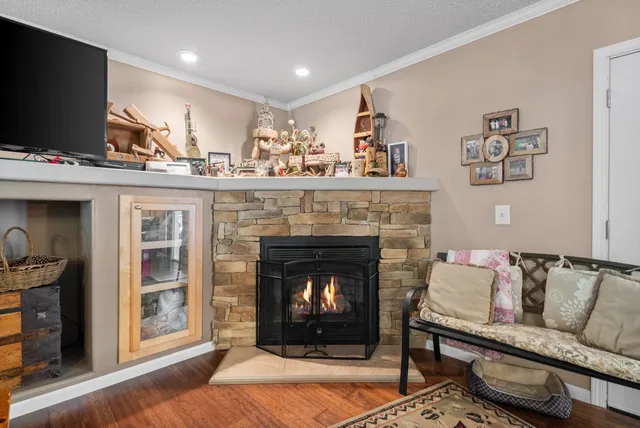 a kitchen with a refrigerator a stove top oven a sink and cabinets