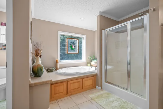 a bed room with a bed and a chandelier