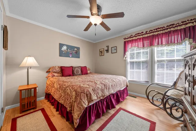 a bathroom with a sink a toilet and shower curtain