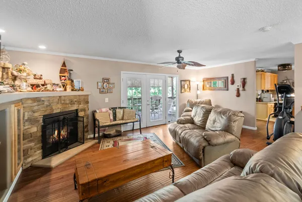 a living room with furniture fireplace and a flat screen tv