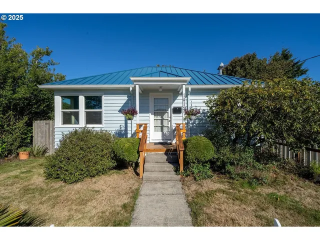 a front view of a house with garden