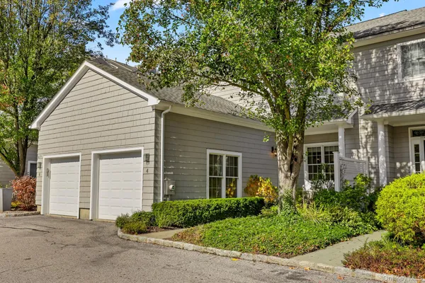 a house with a tree in front of it