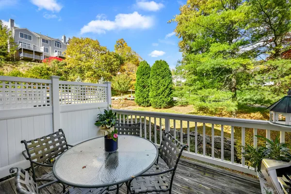 a view of a chairs and table in the patio