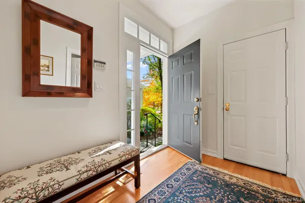 a room with natural light and wooden floor