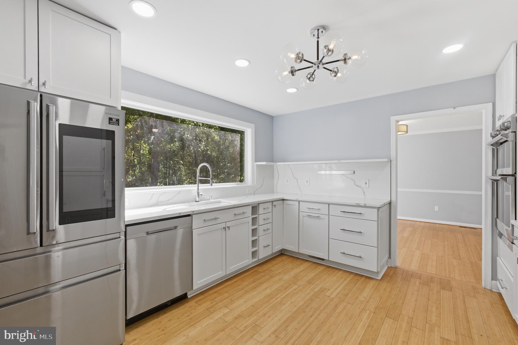13601 Pendleton Street Fort Washington, MD 20744 - Photo 11 of 50 a kitchen with white cabinets and white appliances