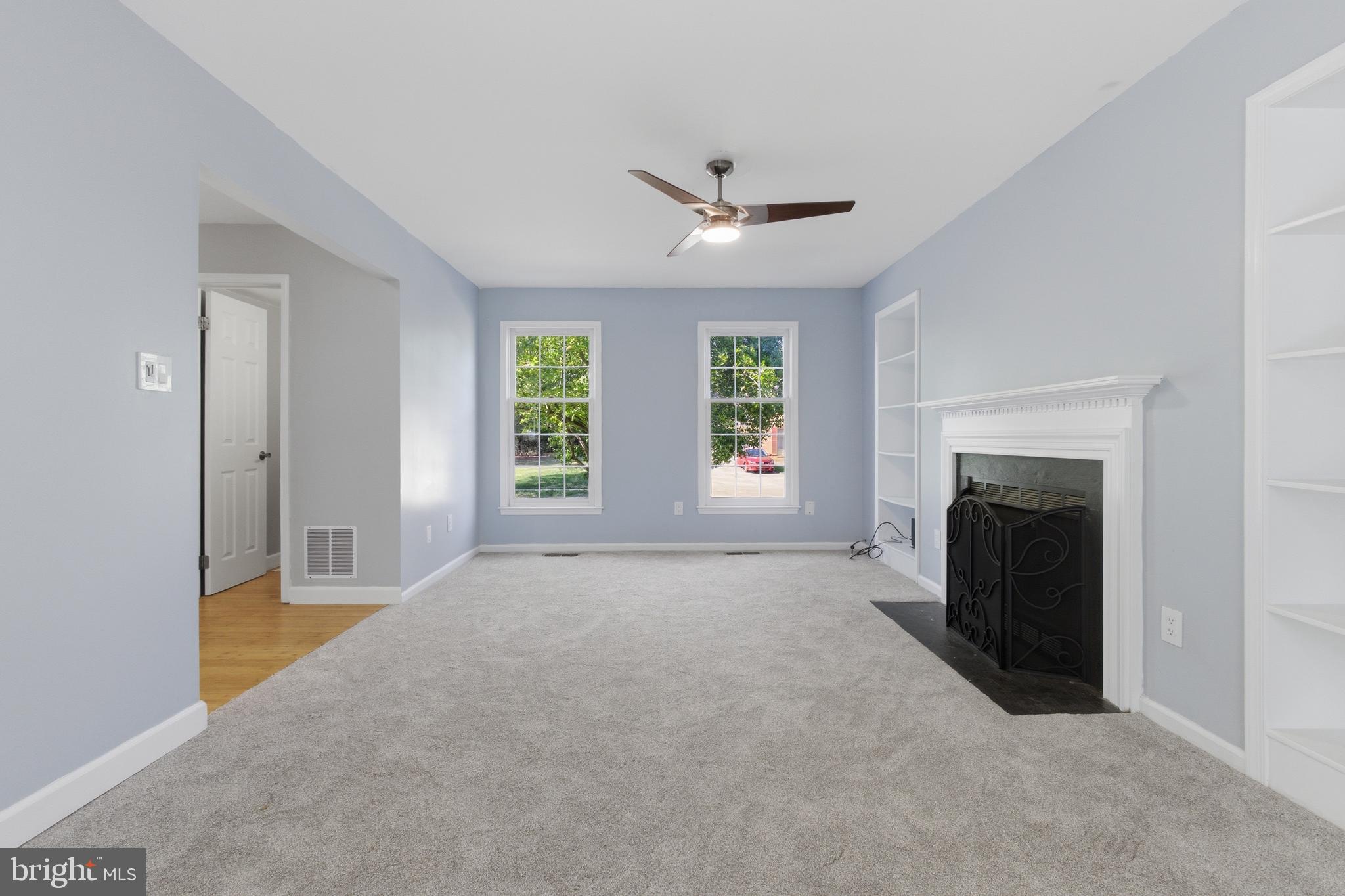 13601 Pendleton Street Fort Washington, MD 20744 - Photo 16 of 50 a view of an empty room with a fireplace and a window