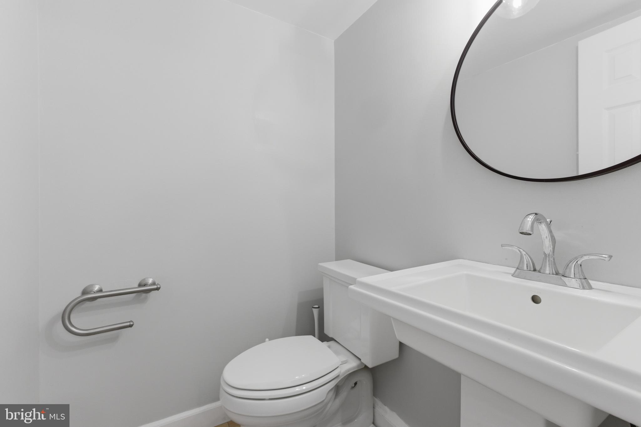 13601 Pendleton Street Fort Washington, MD 20744 - Photo 17 of 50 a bathroom with a sink mirror and toilet