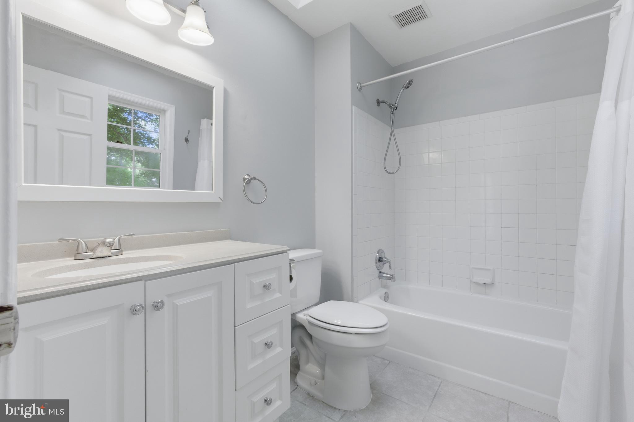13601 Pendleton Street Fort Washington, MD 20744 - Photo 24 of 50 a bathroom with a granite countertop sink toilet and shower