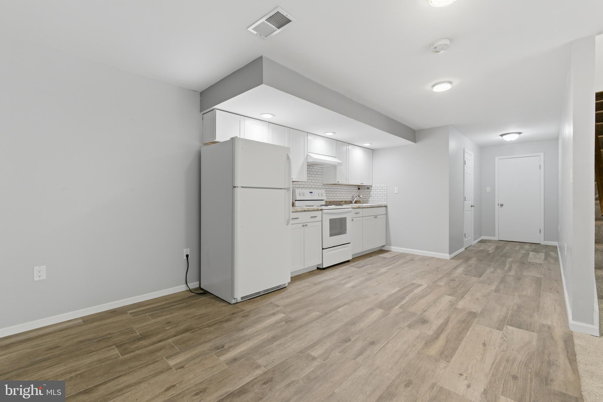 13601 Pendleton Street Fort Washington, MD 20744 - Photo 30 of 50 a view of a kitchen with wooden floor