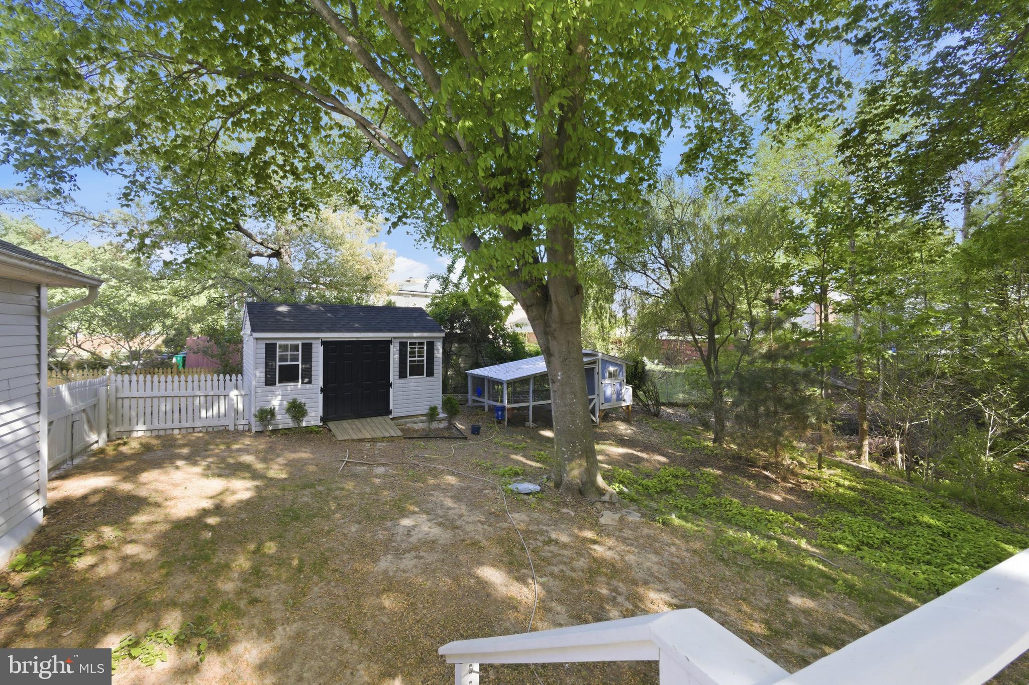 13601 Pendleton Street Fort Washington, MD 20744 - Photo 42 of 50 a backyard of a house with table and chairs