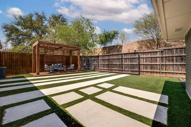 a view of a backyard with a small pool