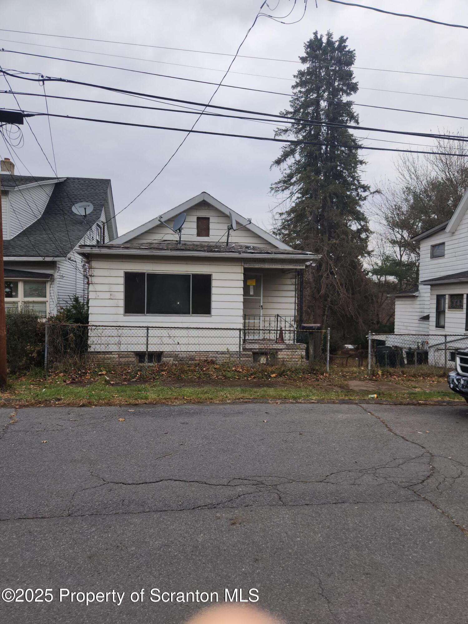 819 Brook Street Scranton, PA 18505 - Photo 1 of 26 a front view of a house with a yard