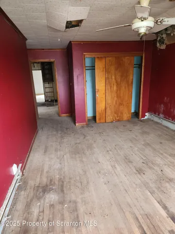 a view of empty room with a fireplace