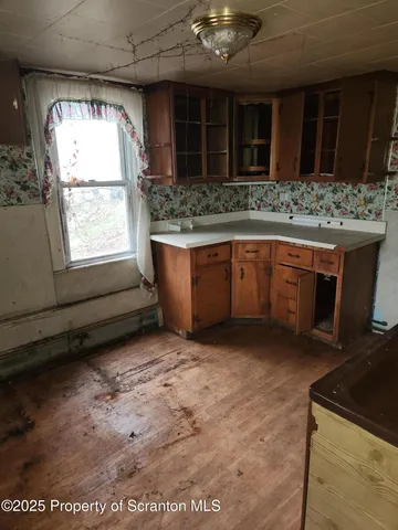 a kitchen with stainless steel appliances granite countertop a stove sink and cabinets