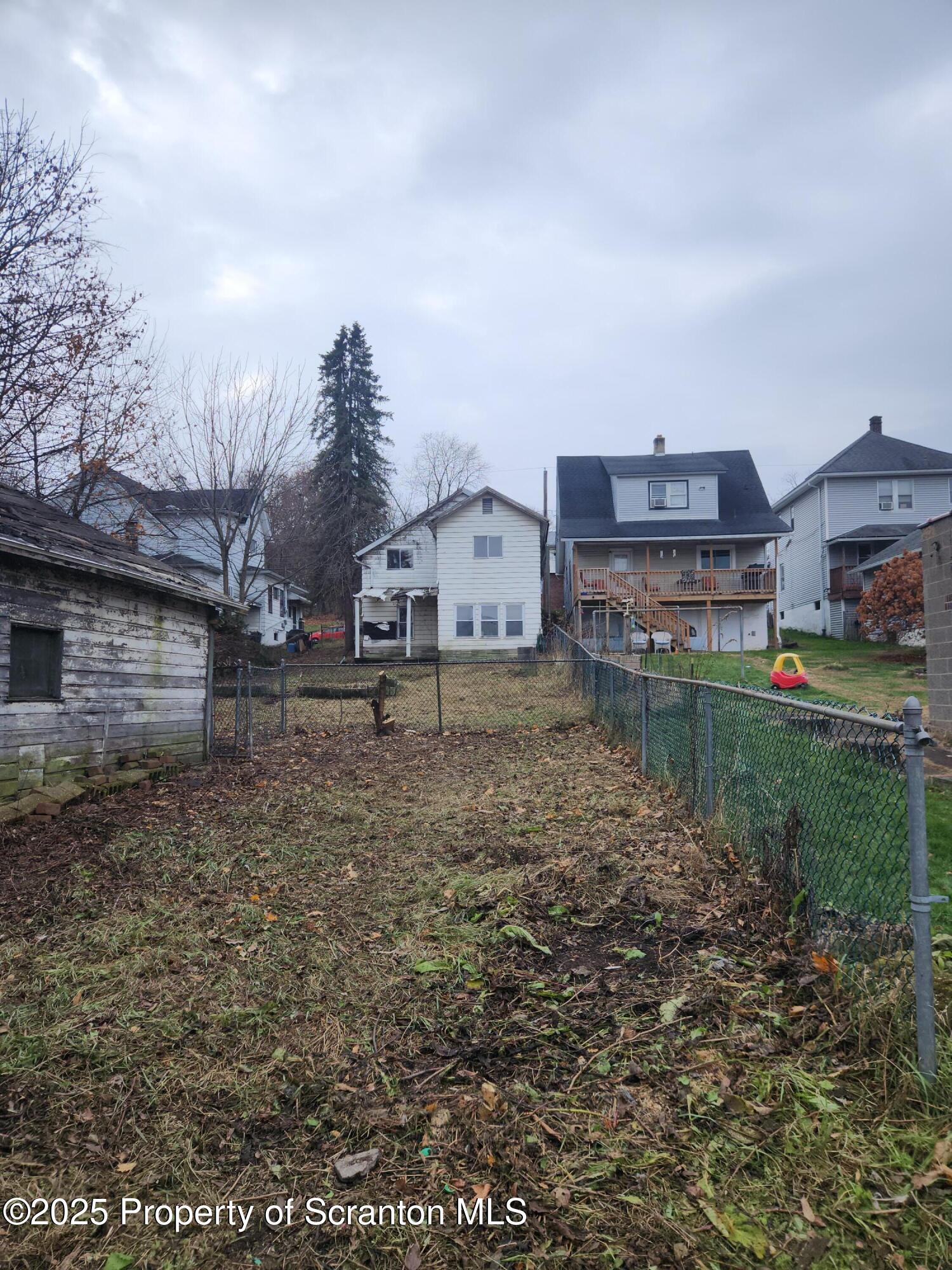 819 Brook Street Scranton, PA 18505 - Photo 4 of 26 a large house with a big yard and large trees