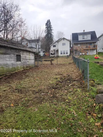 a view of a house with a back yard