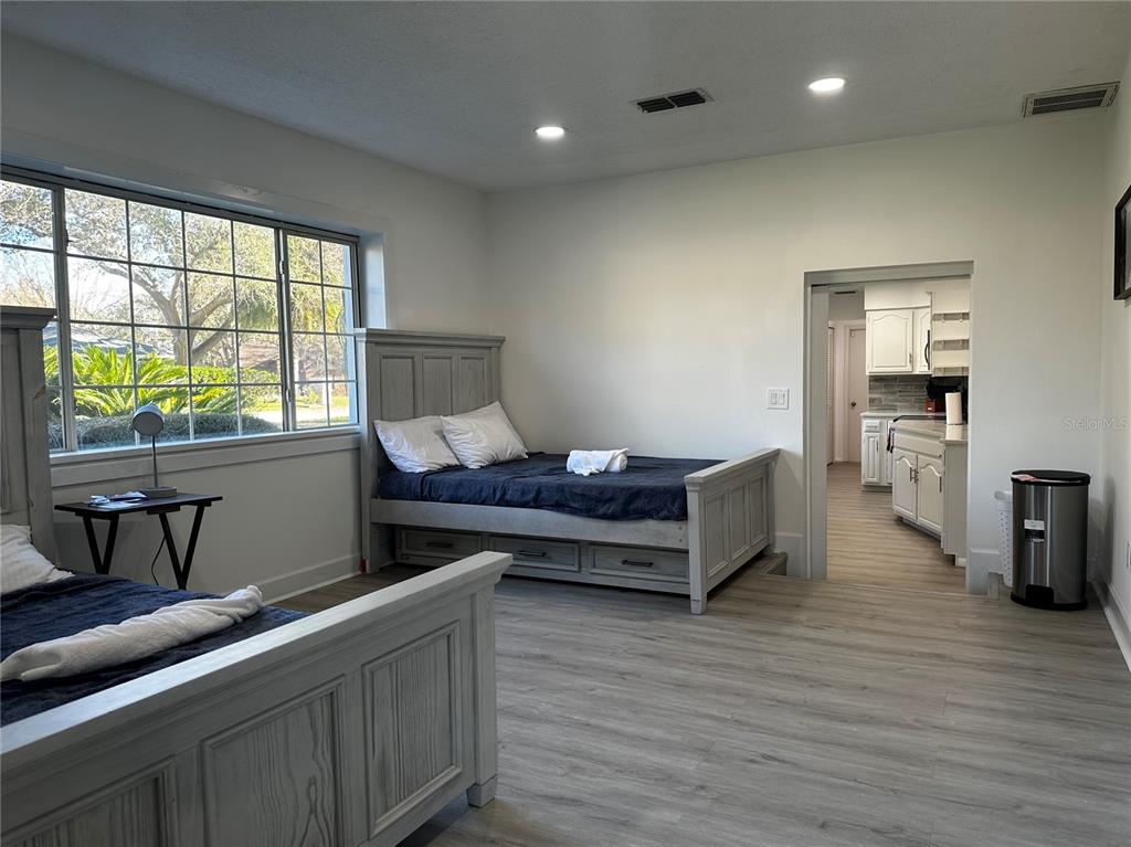 5144 Pine Tree Lane Wesley Chapel, FL 33543 - Photo 6 of 13 a living room with furniture and a wooden floor