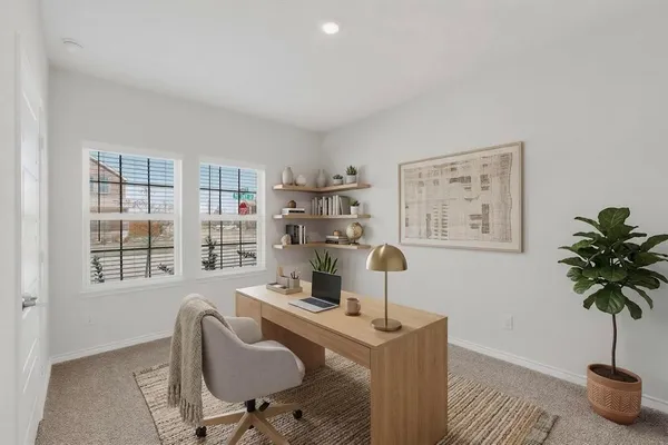 a work room with furniture and windows