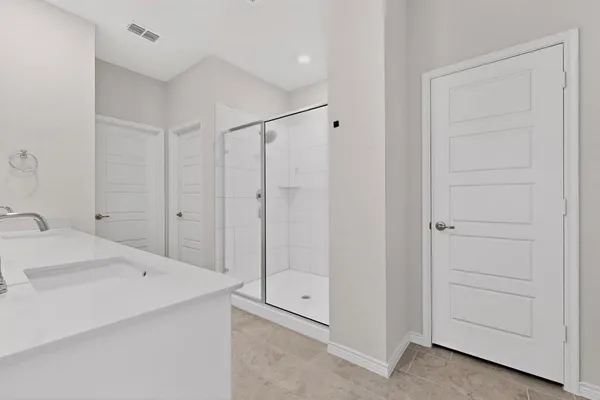 a bathroom with a sink and a shower