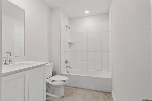 a bathroom with a sink a toilet and a bathtub