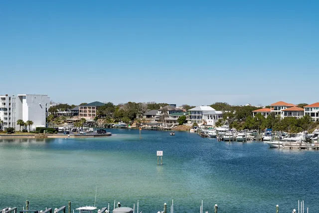 a spacious bathroom with a granite countertop sink a mirror and a bathtub