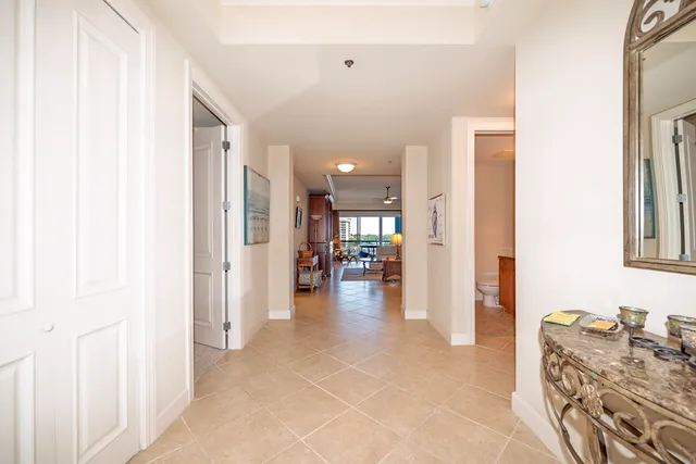 a living room with furniture a dining table and chairs with kitchen view