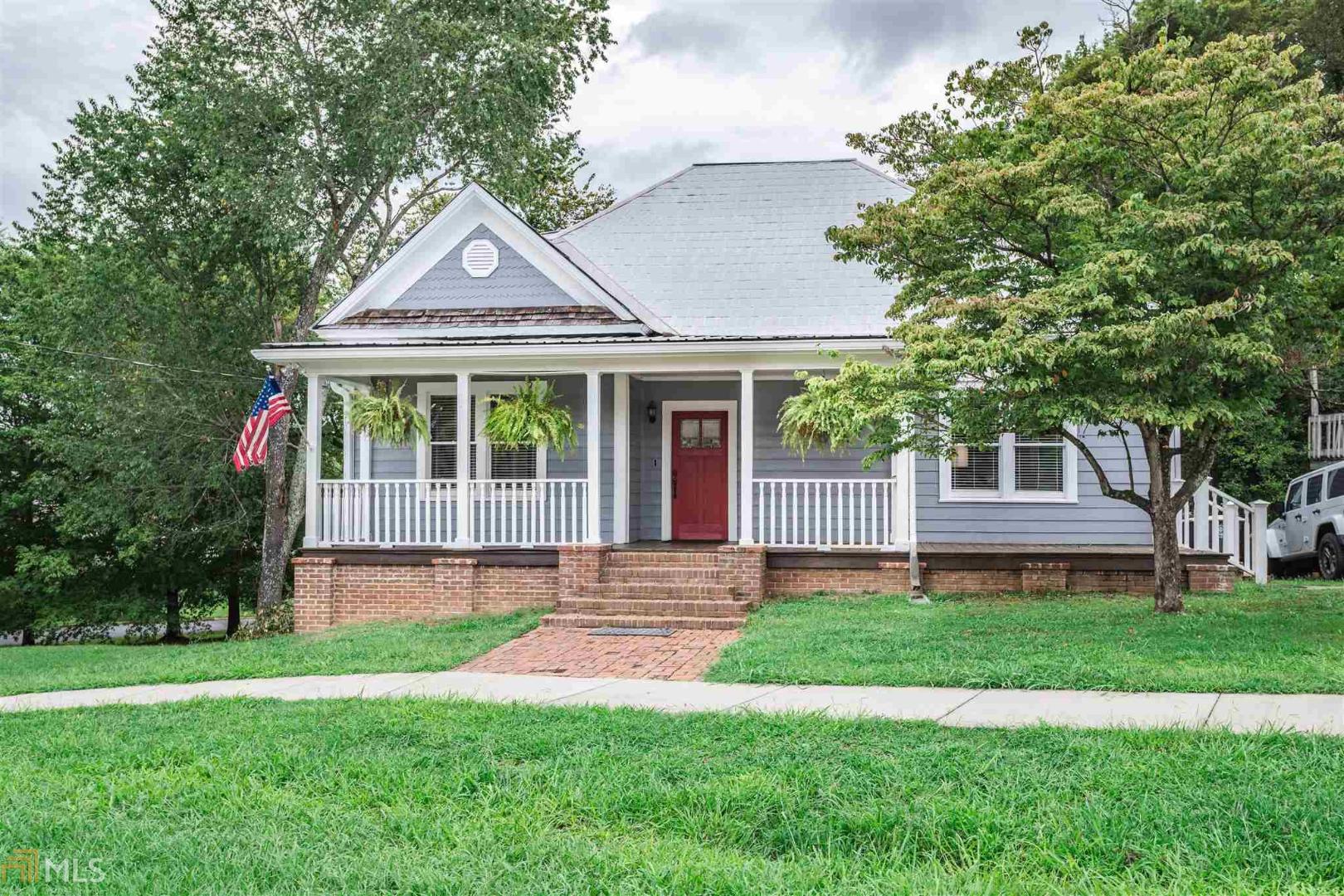 14 Coral Avenue Southwest Rome, GA 30161 - Photo 1 of 1 a front view of a house with a yard and trees