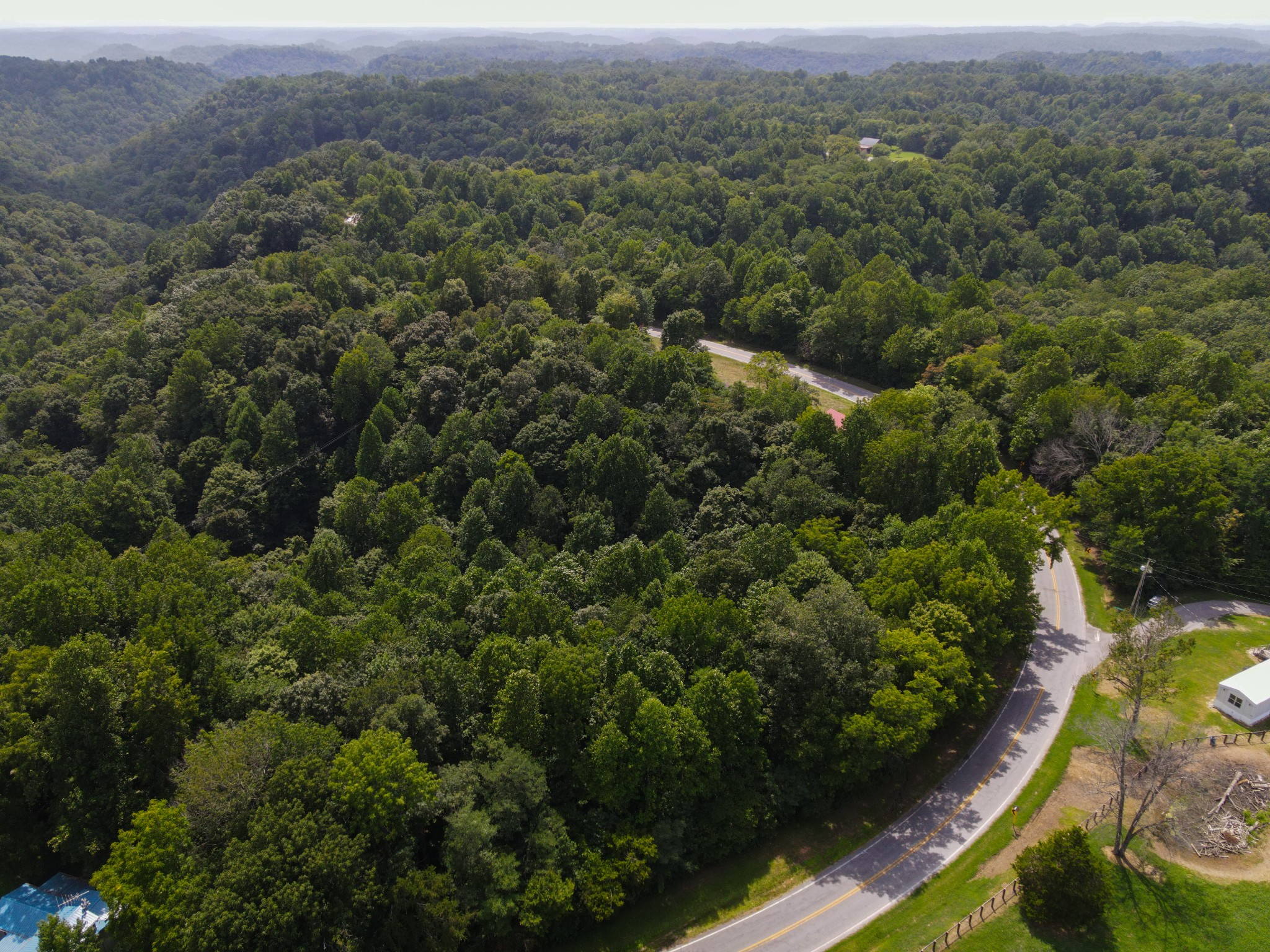 14776 Center Hill Dam Road Silver Point, TN 38582 - Photo 14 of 16 an aerial view of residential house with outdoor space and trees all around