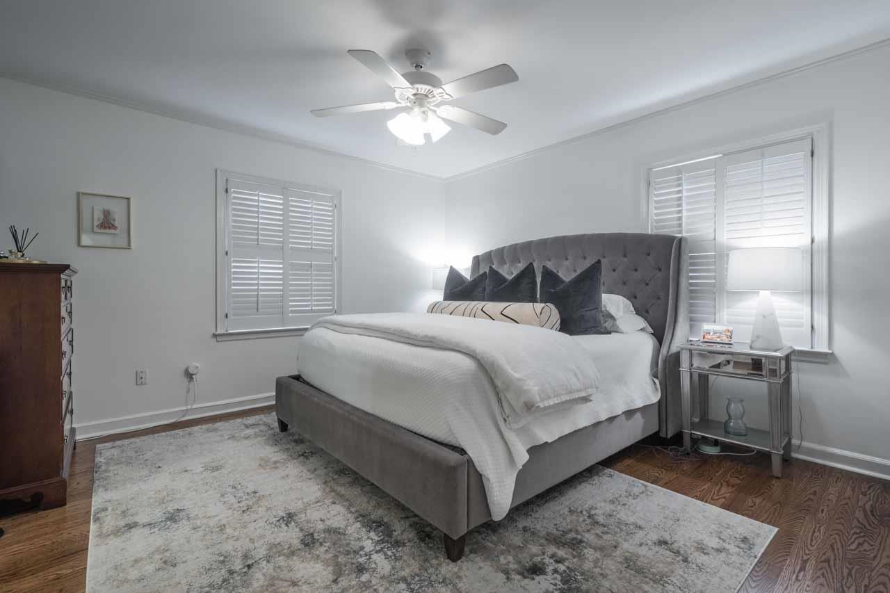 154 North Rose Road Memphis, TN 38117 - Photo 12 of 23 a bedroom with a bed and a chandelier