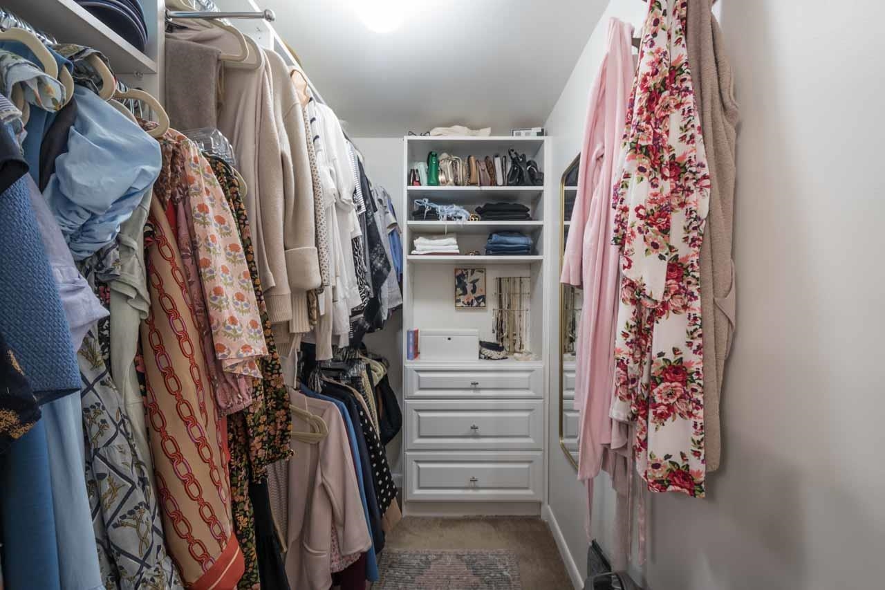 154 North Rose Road Memphis, TN 38117 - Photo 15 of 23 a view of walk in closet with clothes and shoes