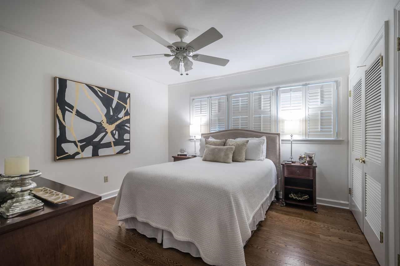 154 North Rose Road Memphis, TN 38117 - Photo 16 of 23 a bedroom with a bed and a chandelier