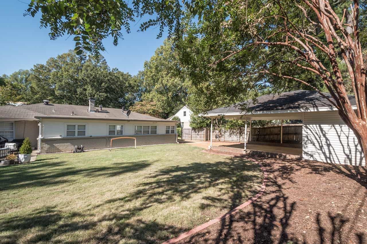154 North Rose Road Memphis, TN 38117 - Photo 22 of 23 a view of a house with backyard and sitting area