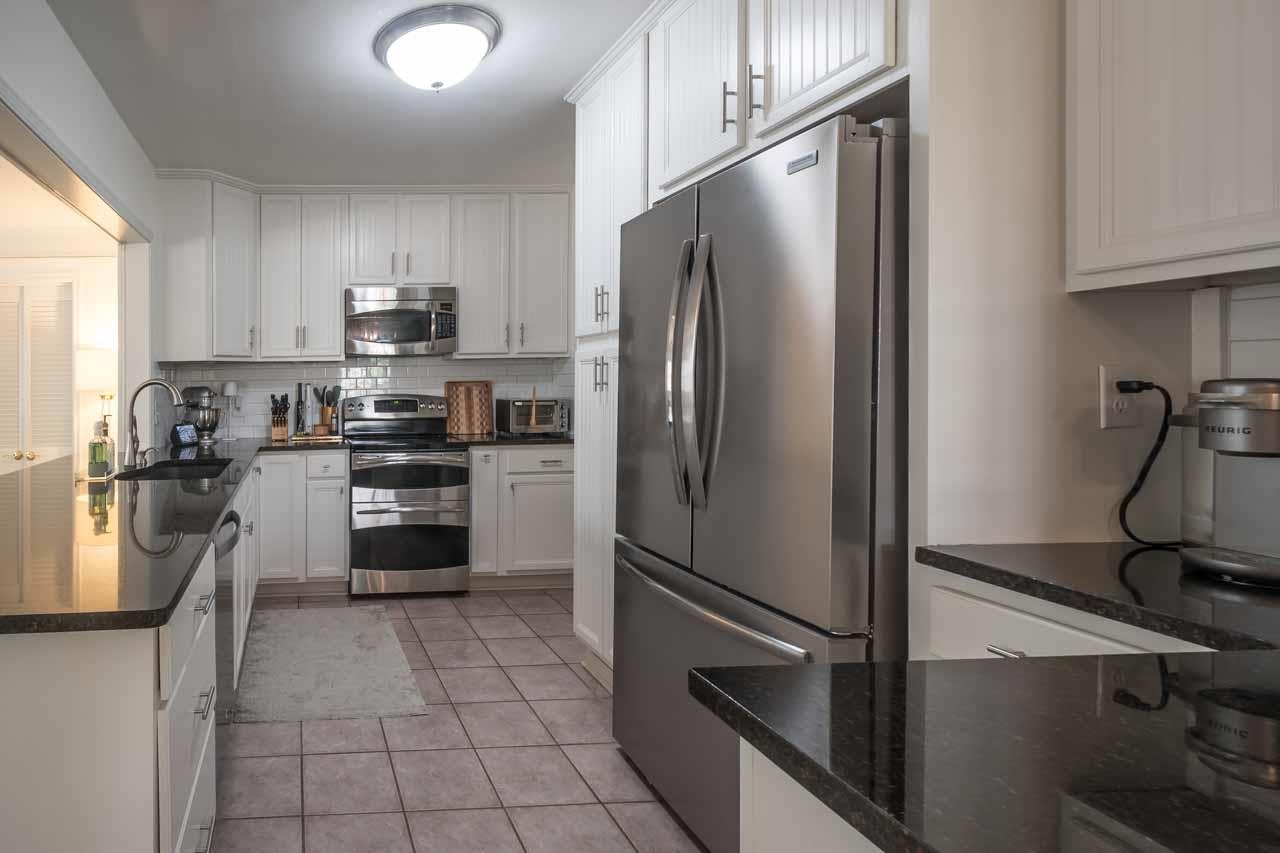 154 North Rose Road Memphis, TN 38117 - Photo 10 of 23 a kitchen with stainless steel appliances a refrigerator sink and microwave
